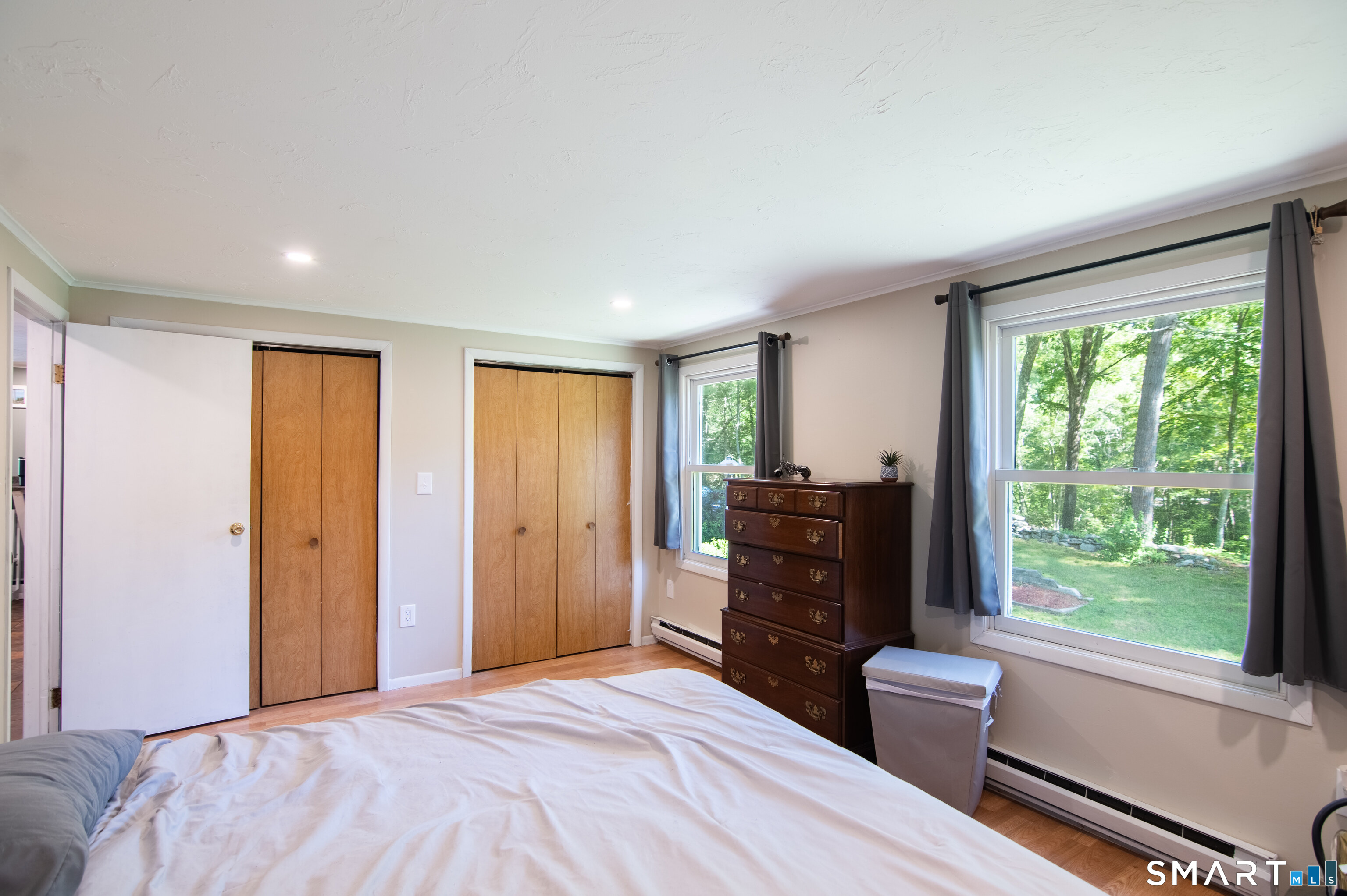 109 Munyan Road Putnam, CT 06260 - Photo 26 of 38 Primary bedroom with fireplace, double closets, on the main level