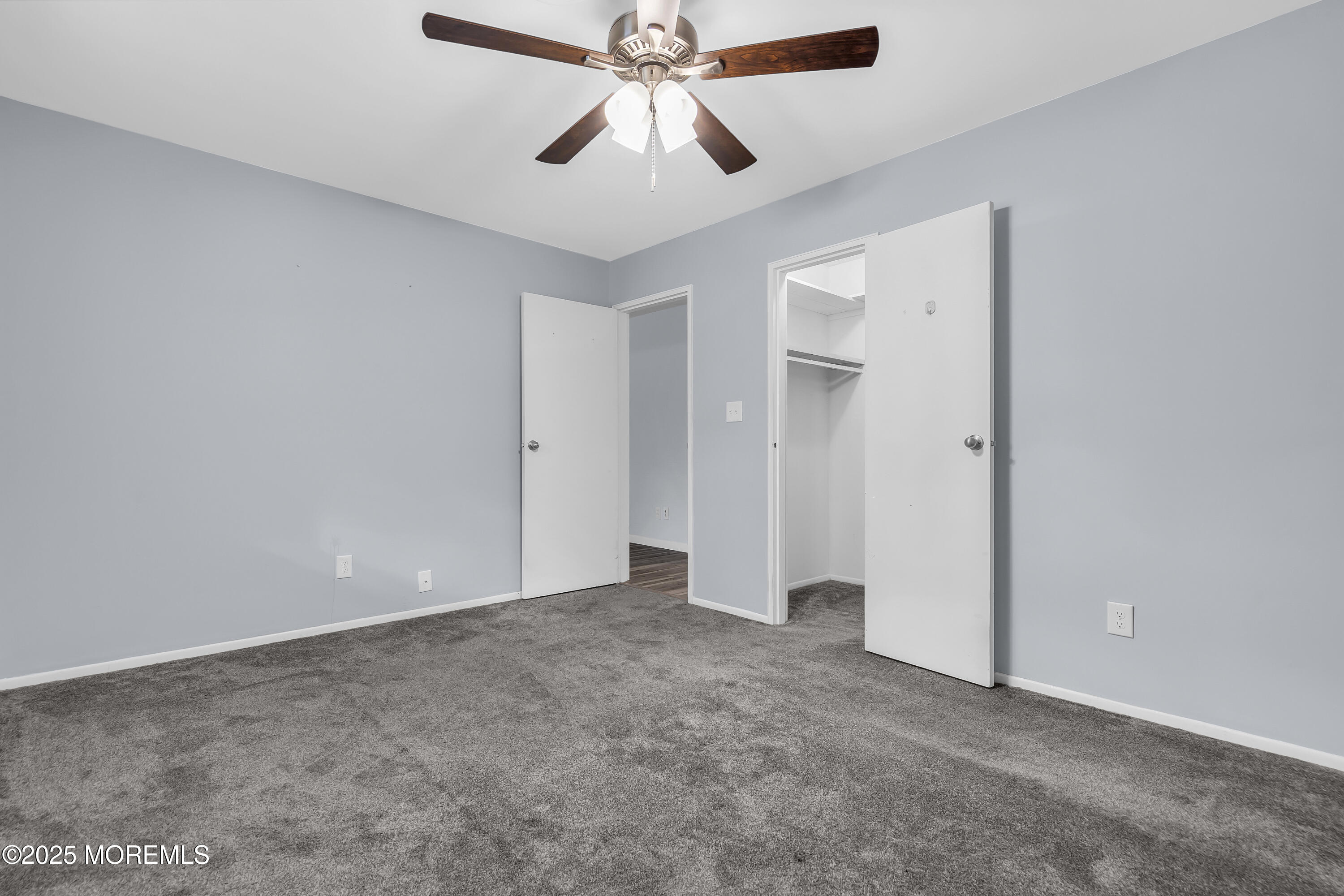 7 B Roosevelt City Road, Unit B Whiting, NJ 08759 - Photo 13 of 48 an empty room with chandelier fan