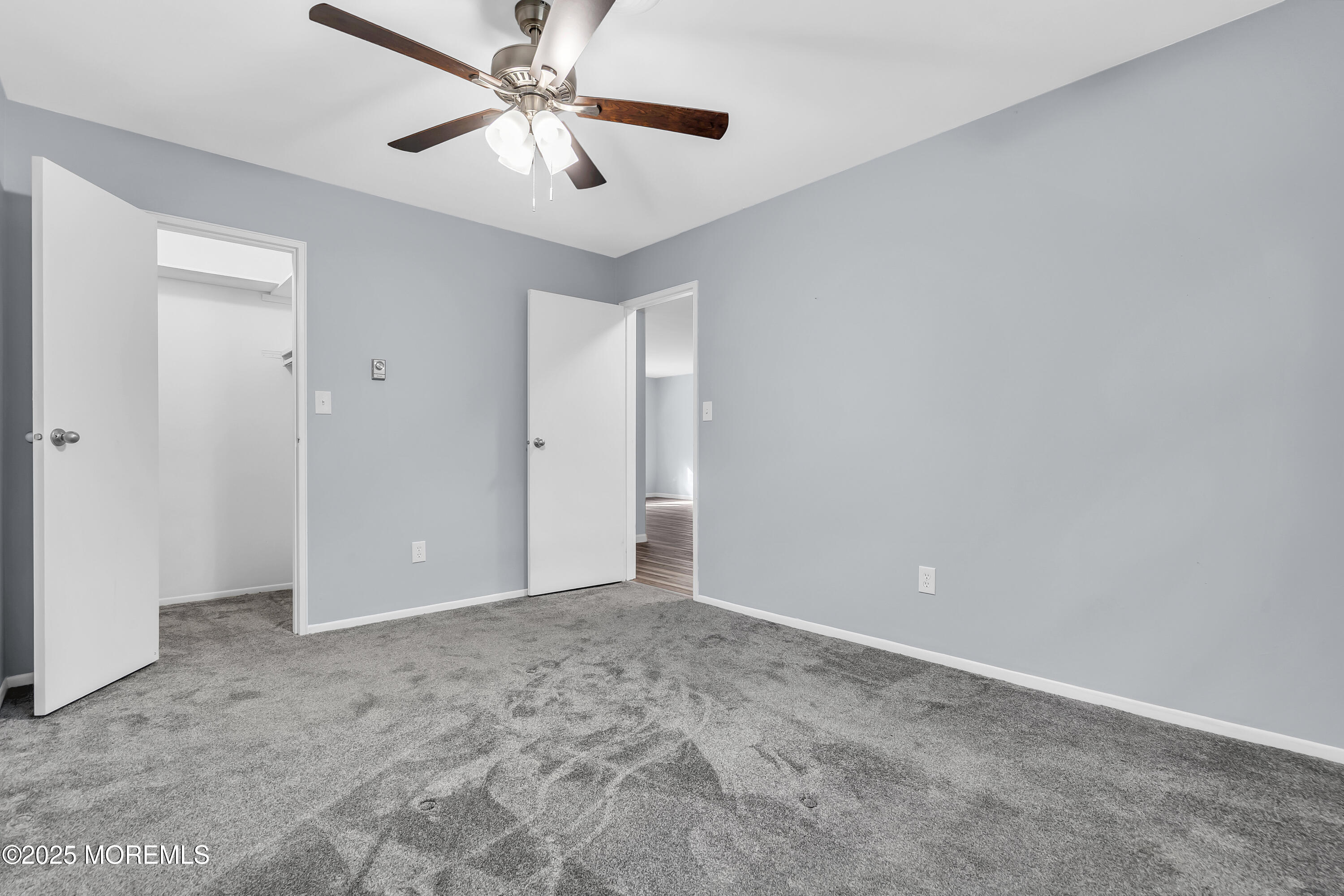 7 B Roosevelt City Road, Unit B Whiting, NJ 08759 - Photo 14 of 48 a view of an empty room and chandelier fan