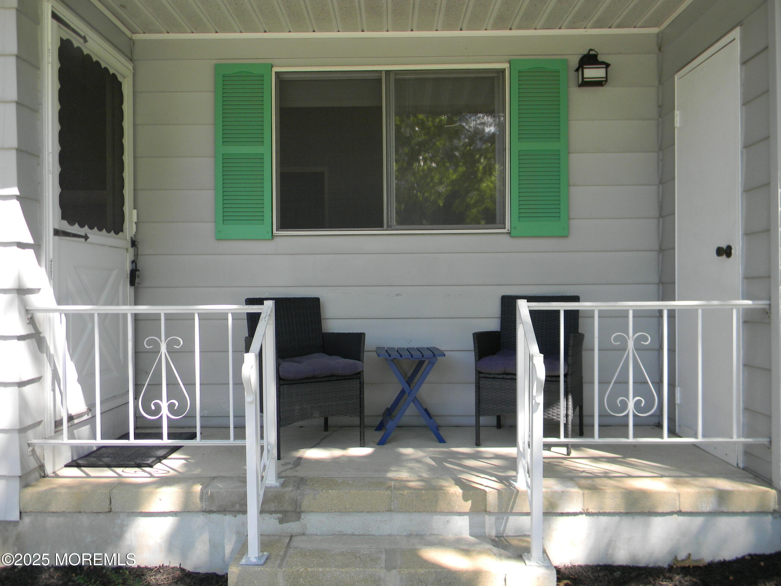 7 B Roosevelt City Road, Unit B Whiting, NJ 08759 - Photo 19 of 48 a view of a brick house with a bench in front of building