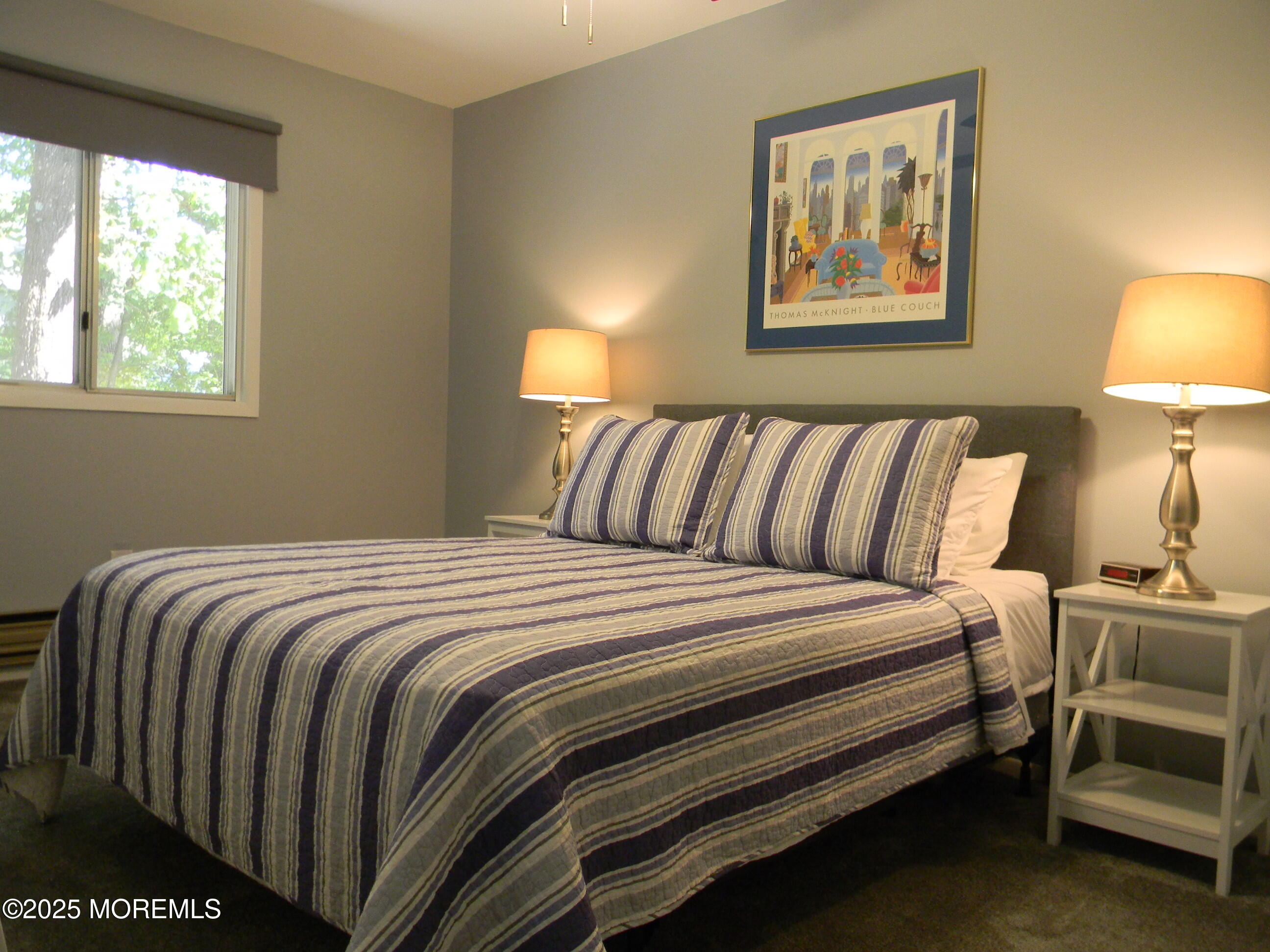 7 B Roosevelt City Road, Unit B Whiting, NJ 08759 - Photo 25 of 48 a bedroom with a bed and lamp