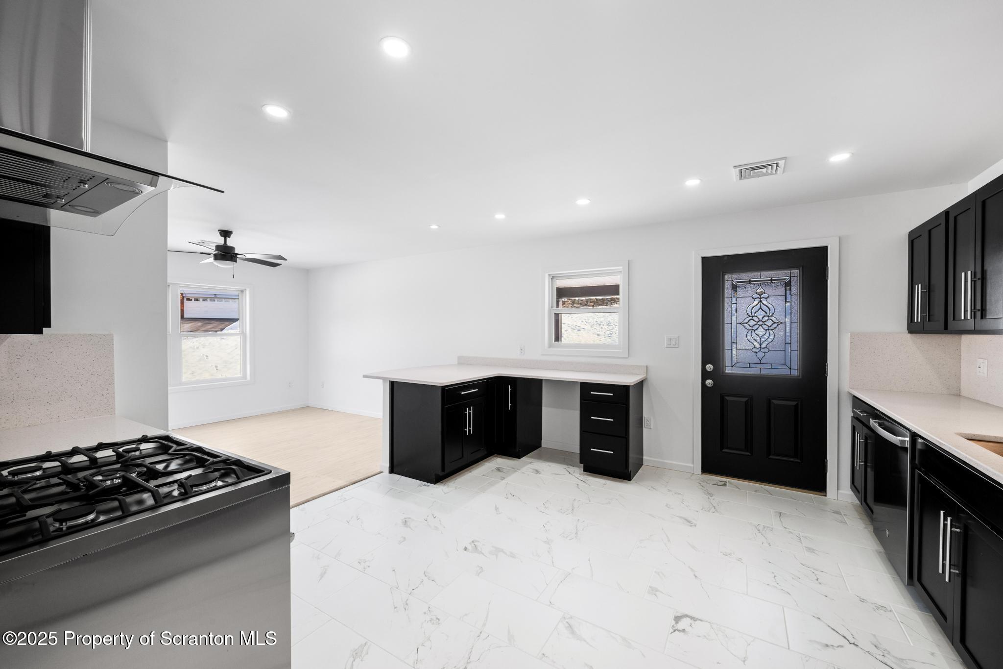 80 Elmhurst Boulevard Scranton, PA 18505 - Photo 13 of 56 a kitchen with stainless steel appliances granite countertop a stove and a refrigerator