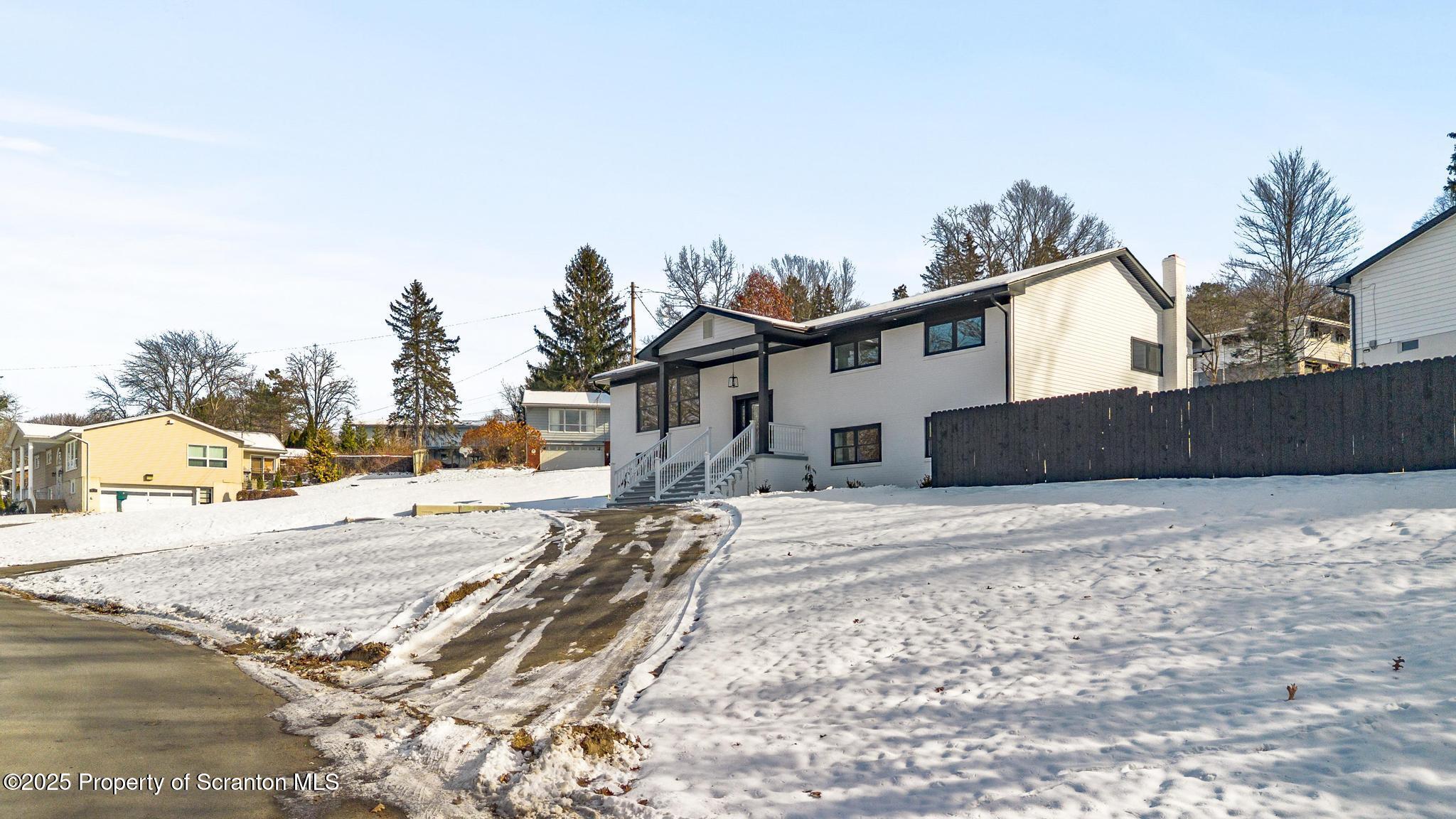 80 Elmhurst Boulevard Scranton, PA 18505 - Photo 2 of 56 a view of a house with snow on the road