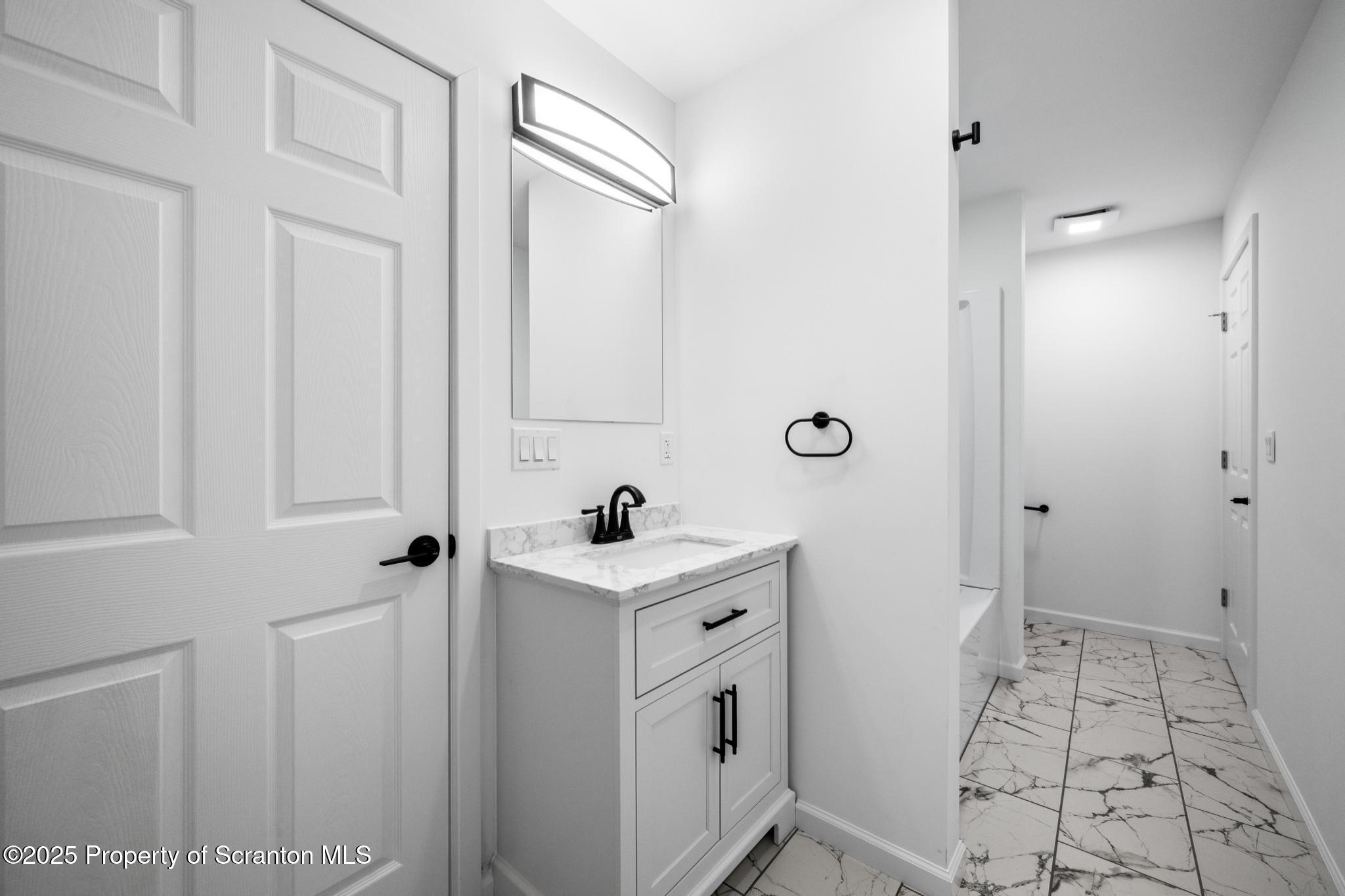 80 Elmhurst Boulevard Scranton, PA 18505 - Photo 23 of 56 a view of a bathroom with sink and mirror