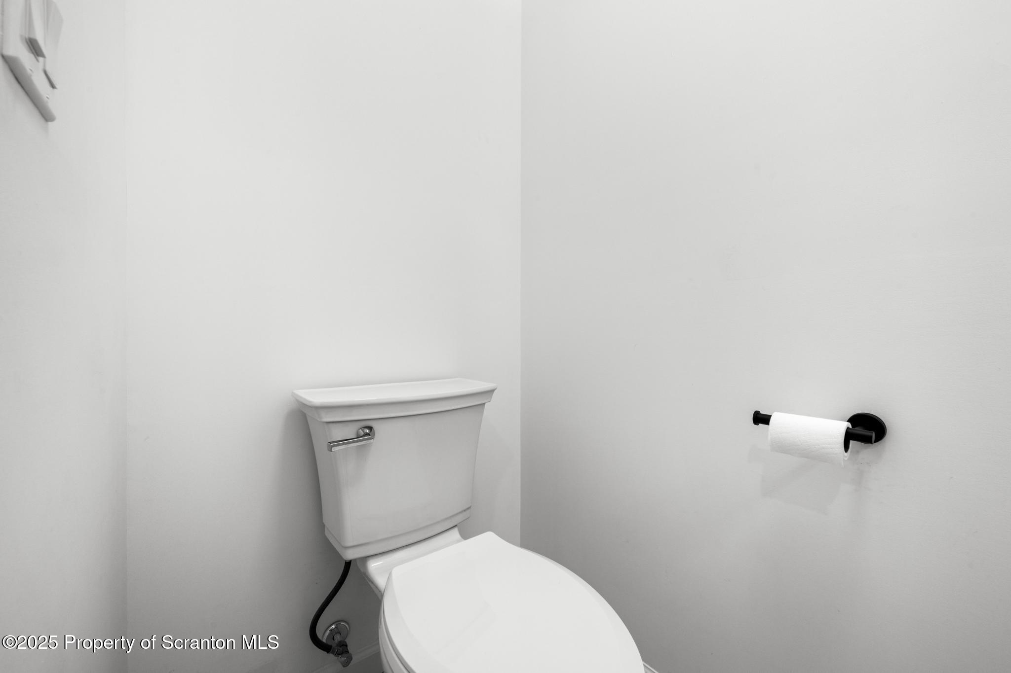 80 Elmhurst Boulevard Scranton, PA 18505 - Photo 27 of 56 a white toilet sitting next to a white wall