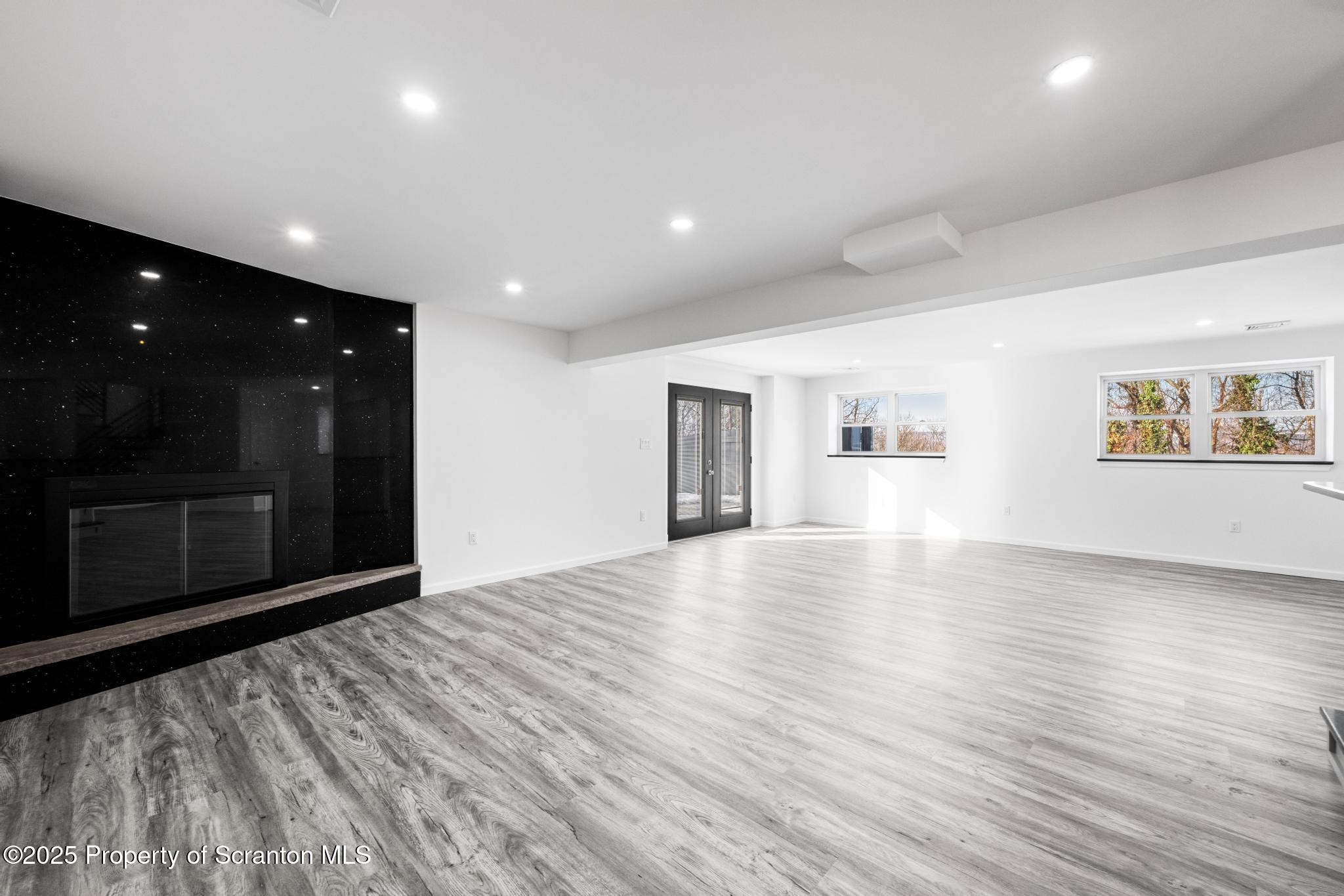80 Elmhurst Boulevard Scranton, PA 18505 - Photo 30 of 56 a view of empty room with wooden floor and windows