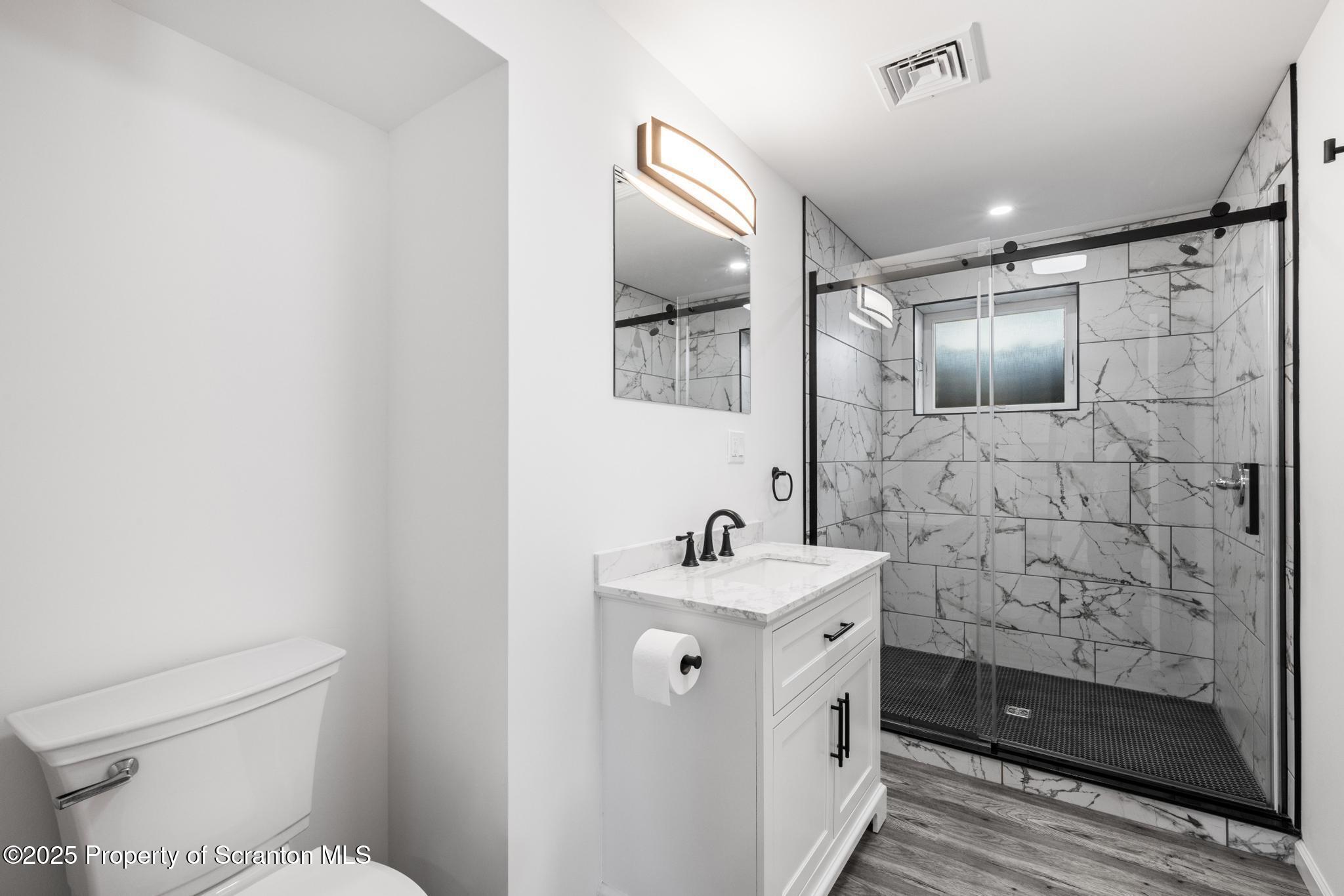 80 Elmhurst Boulevard Scranton, PA 18505 - Photo 37 of 56 a bathroom with a double vanity sink mirror and toilet