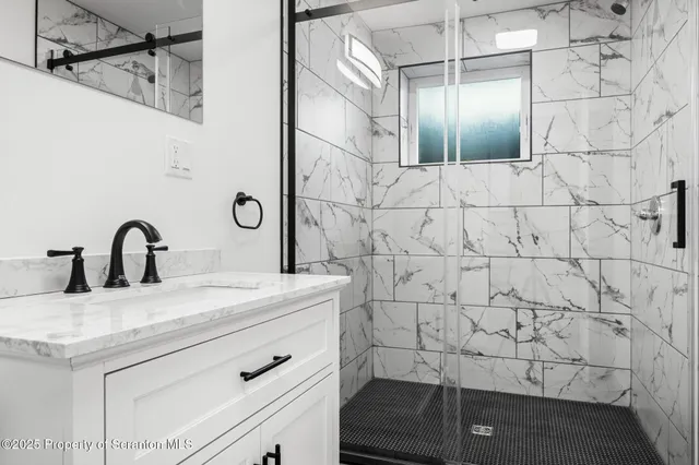 a room with a bed and a dresser