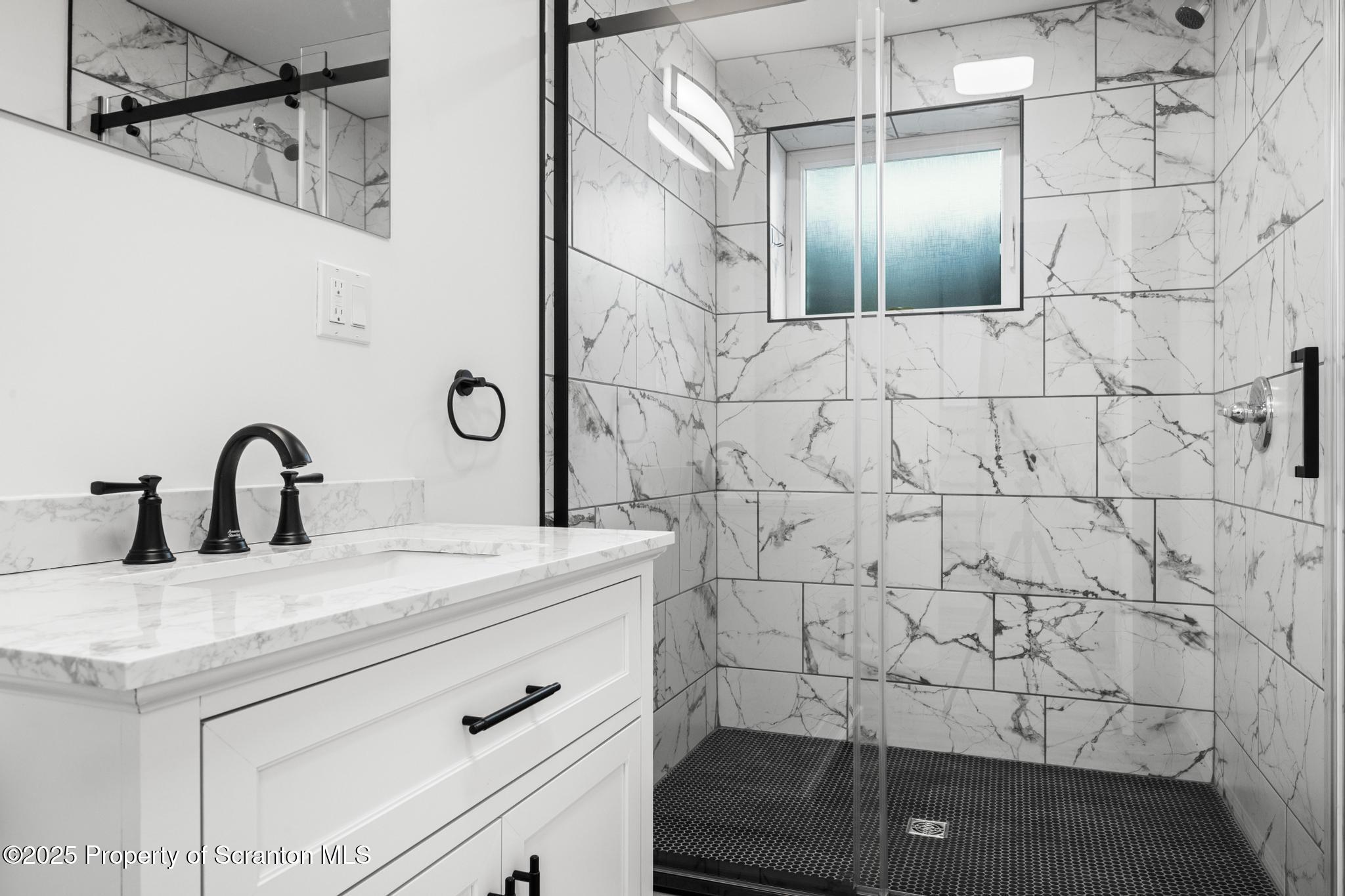 80 Elmhurst Boulevard Scranton, PA 18505 - Photo 38 of 56 a bathroom with a sink and vanity