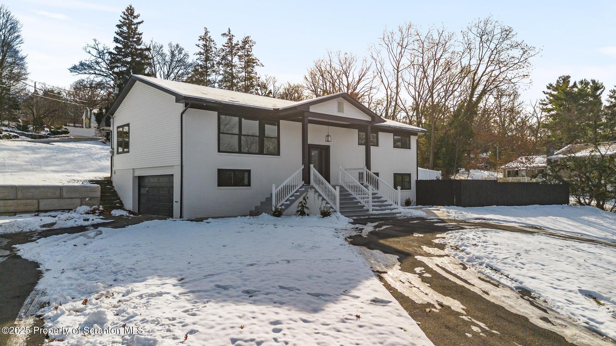 80 Elmhurst Boulevard Scranton, PA 18505 - Photo 5 of 56 a view of a house with a yard covered in snow
