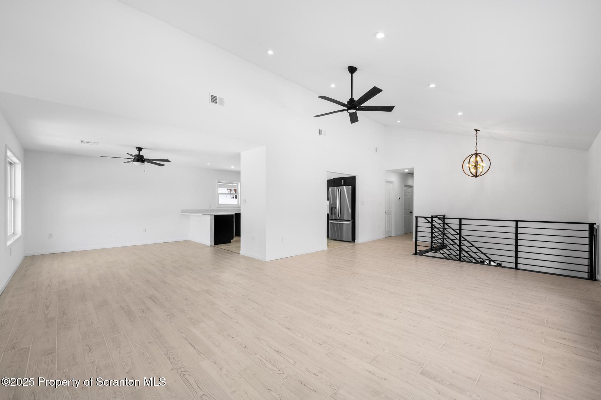 80 Elmhurst Boulevard Scranton, PA 18505 - Photo 8 of 56 an empty room with ceiling fan and windows