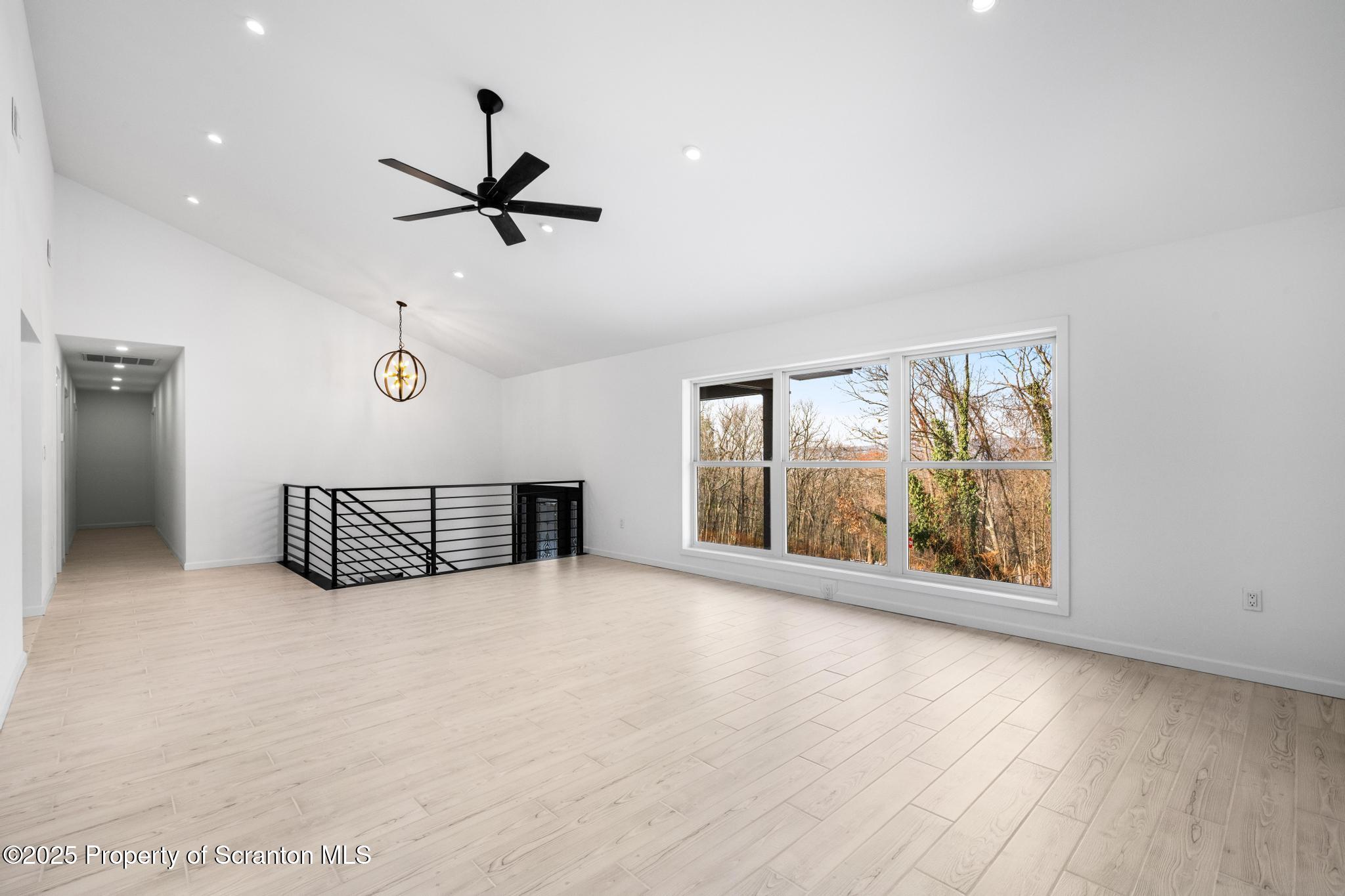 80 Elmhurst Boulevard Scranton, PA 18505 - Photo 9 of 56 an empty room with windows and fan view
