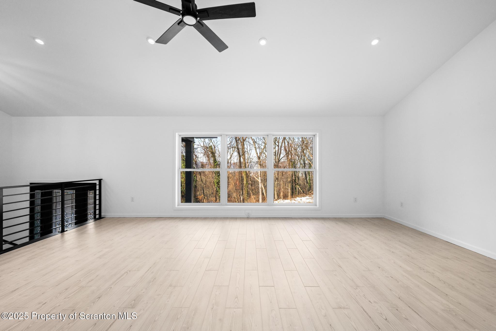 80 Elmhurst Boulevard Scranton, PA 18505 - Photo 10 of 56 a view of an empty room with a window and wooden floor