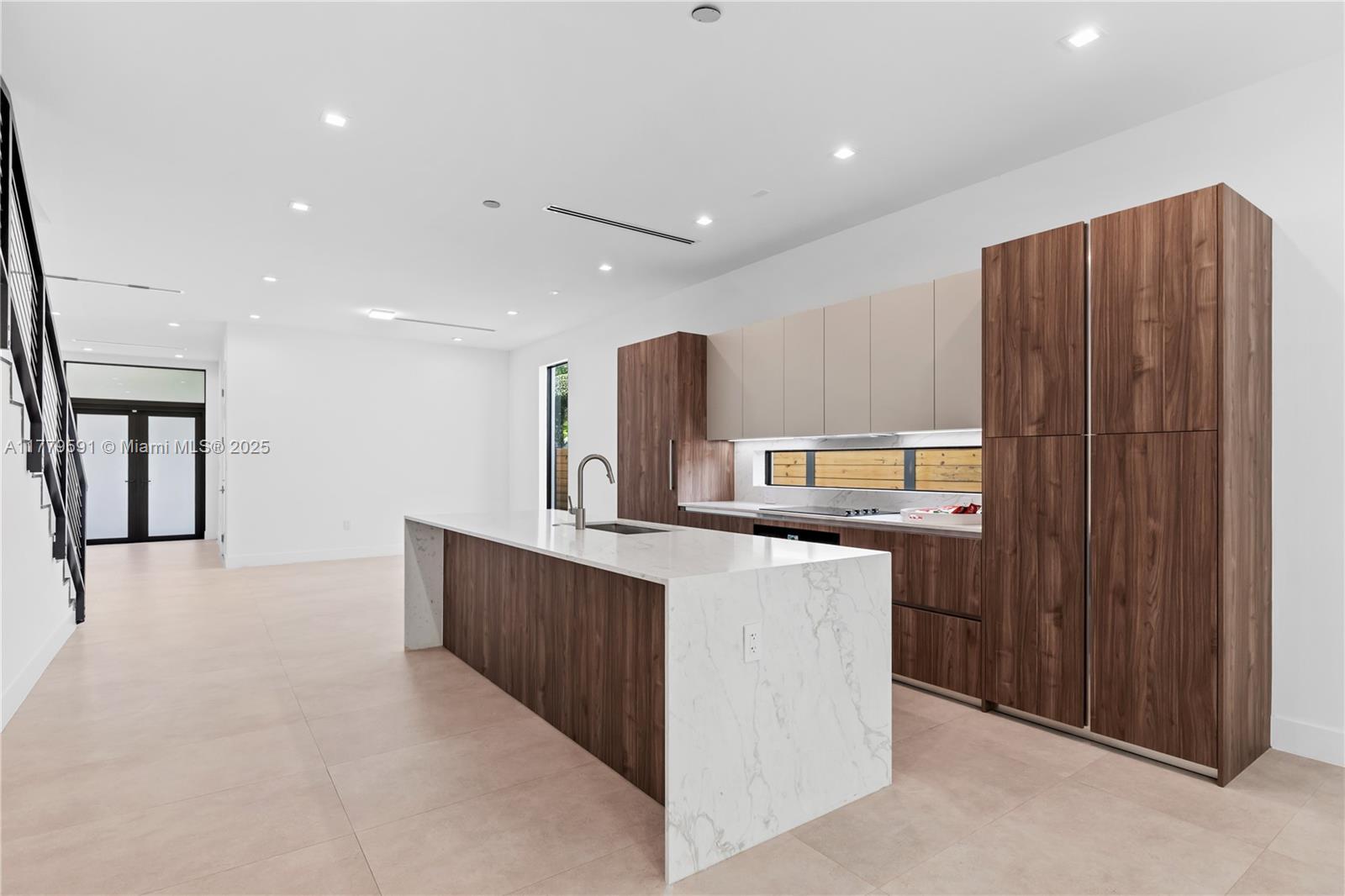 3045 Elizabeth Street, Unit 3045 Miami, FL 33133 - Photo 15 of 72 a kitchen with stainless steel appliances a sink stove and cabinets