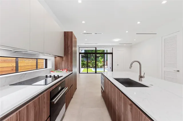 a view of a backyard with swimming pool