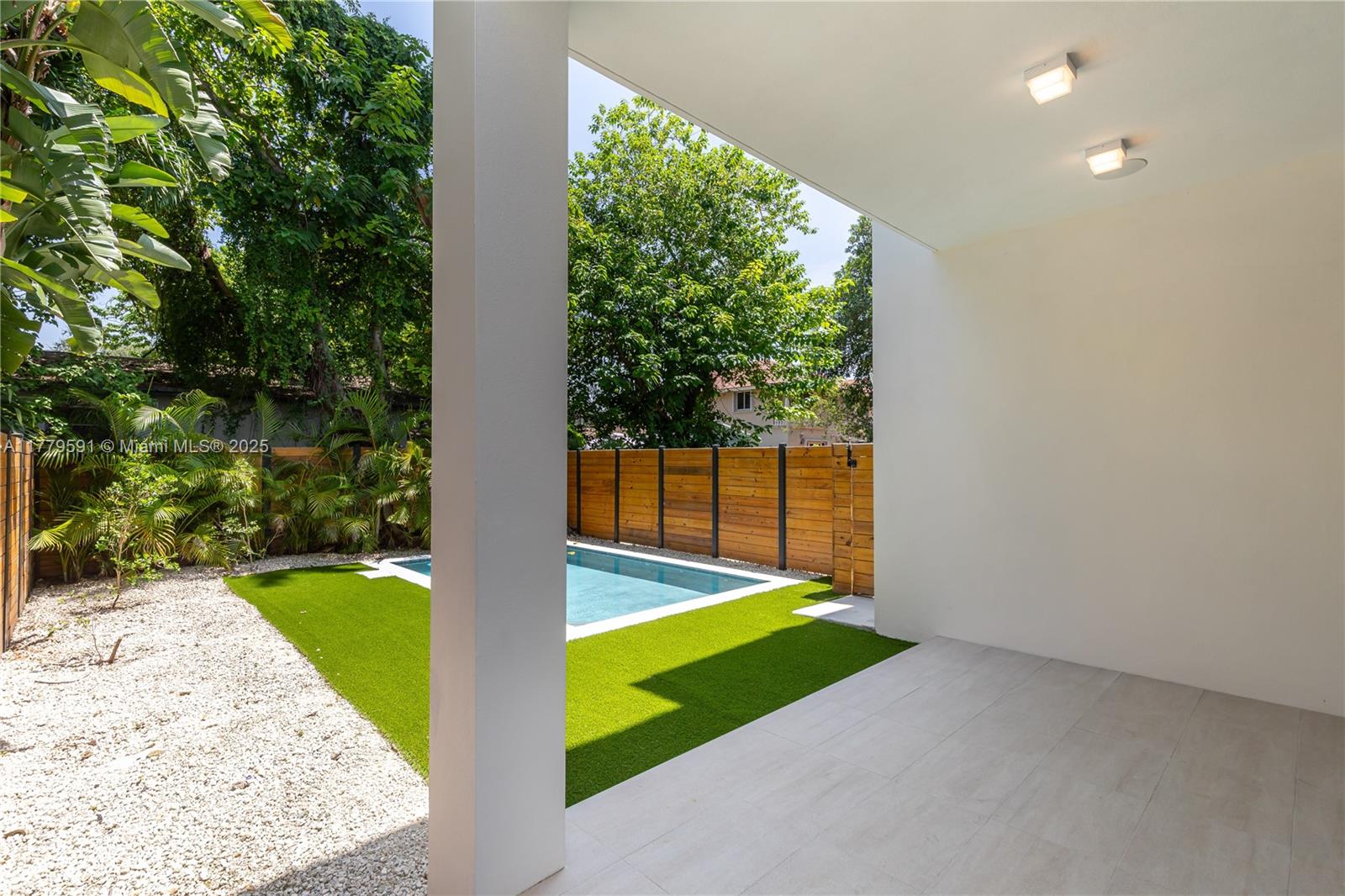 3045 Elizabeth Street, Unit 3045 Miami, FL 33133 - Photo 20 of 72 a view of a backyard with large tree