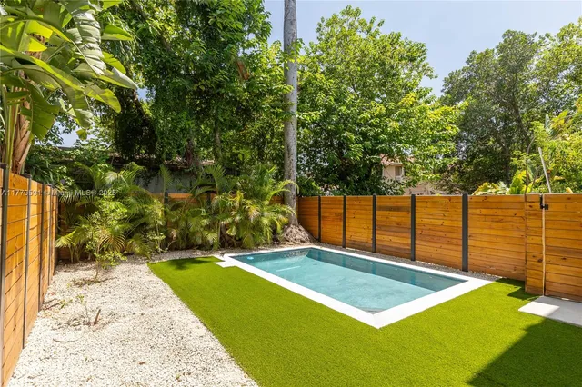 a view of swimming pool with an outdoor seating