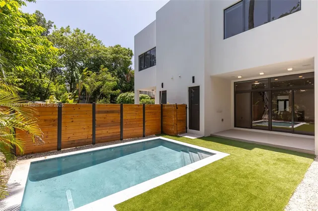 a view of a bathroom with a shower and a sink
