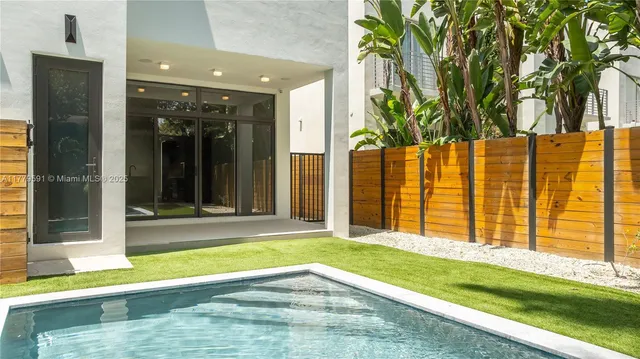 a bathroom with a shower and a sink