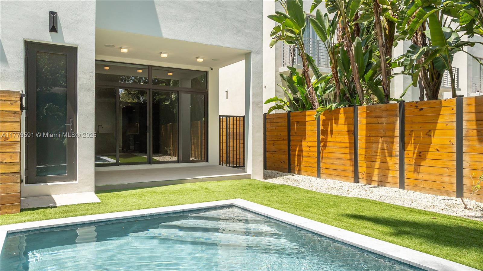 3045 Elizabeth Street, Unit 3045 Miami, FL 33133 - Photo 28 of 72 a view of swimming pool with an outdoor seating