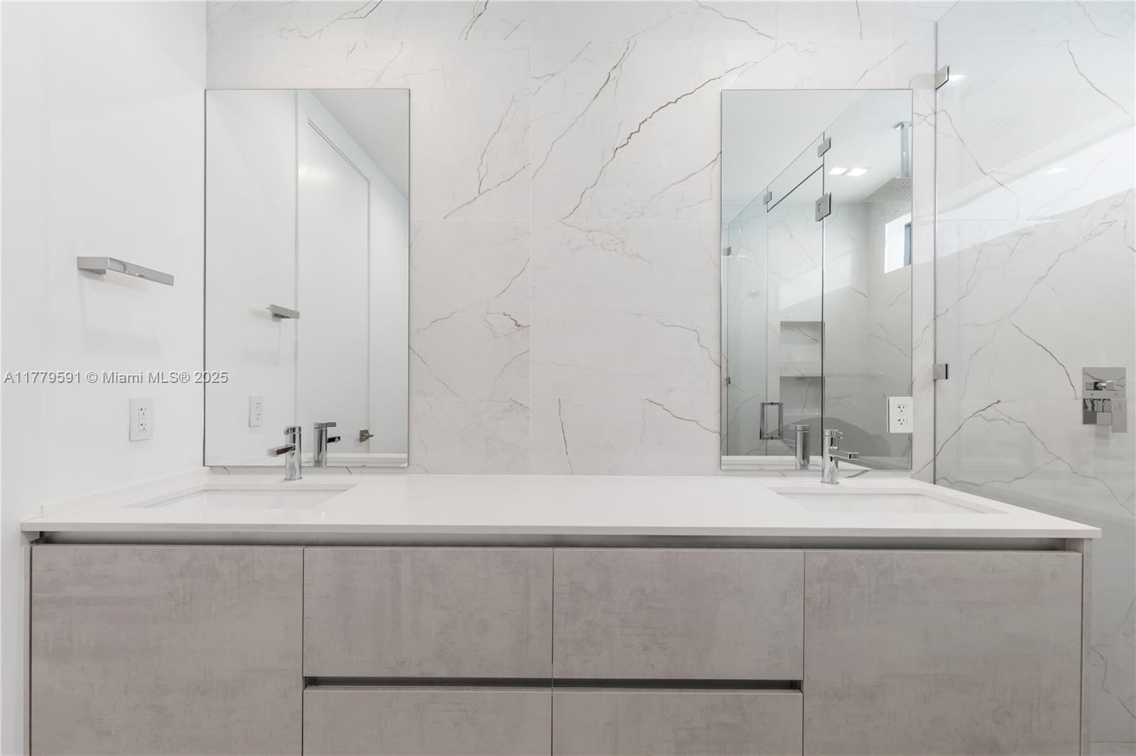 3045 Elizabeth Street, Unit 3045 Miami, FL 33133 - Photo 36 of 72 a bathroom with a sink and a mirror