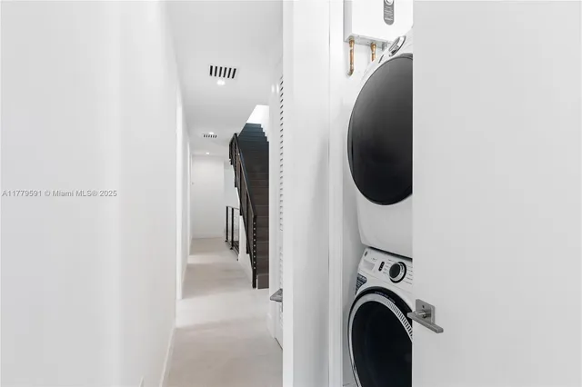 a view of a hallway with windows