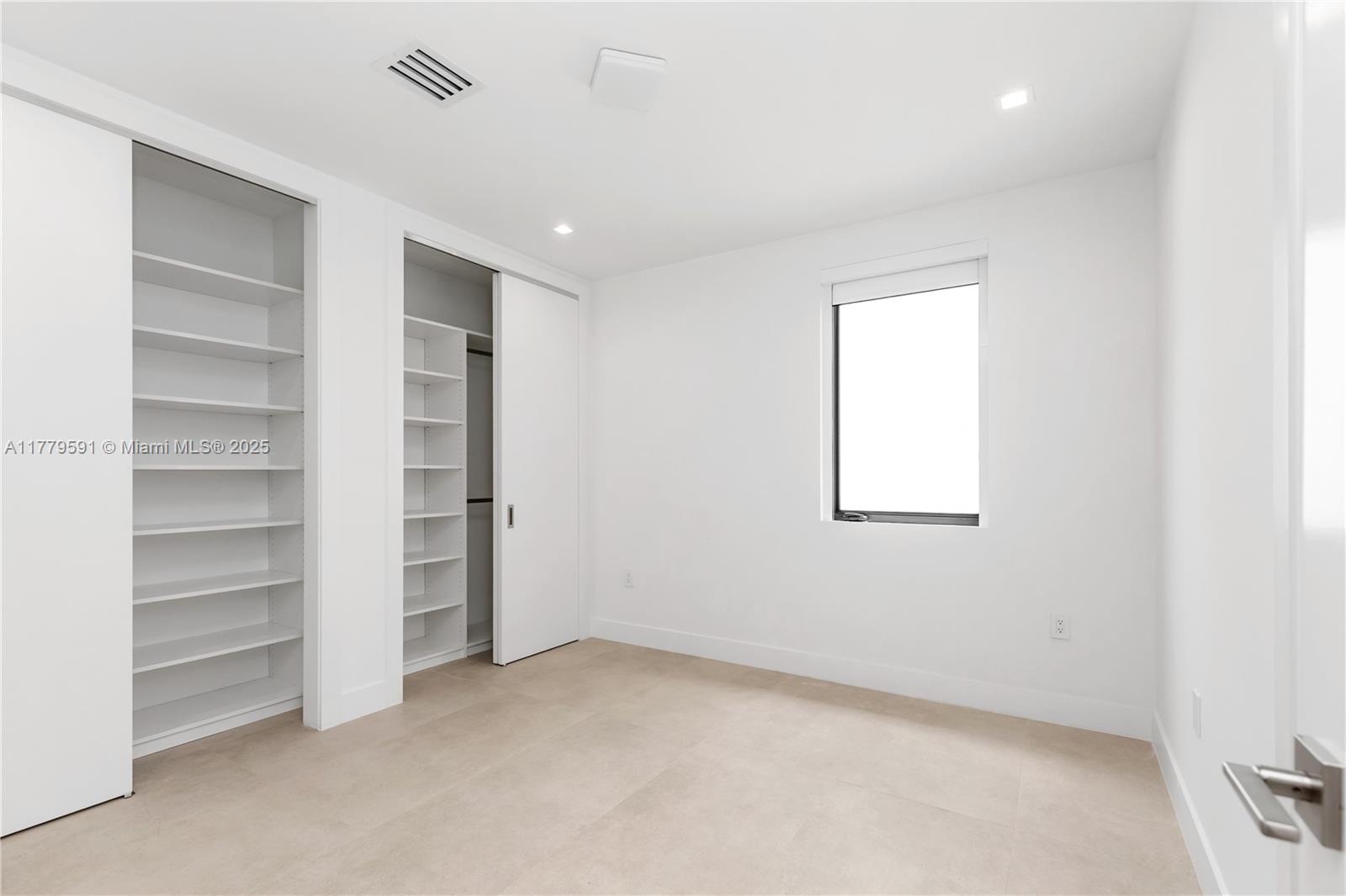 3045 Elizabeth Street, Unit 3045 Miami, FL 33133 - Photo 49 of 72 a view of an empty room with a window