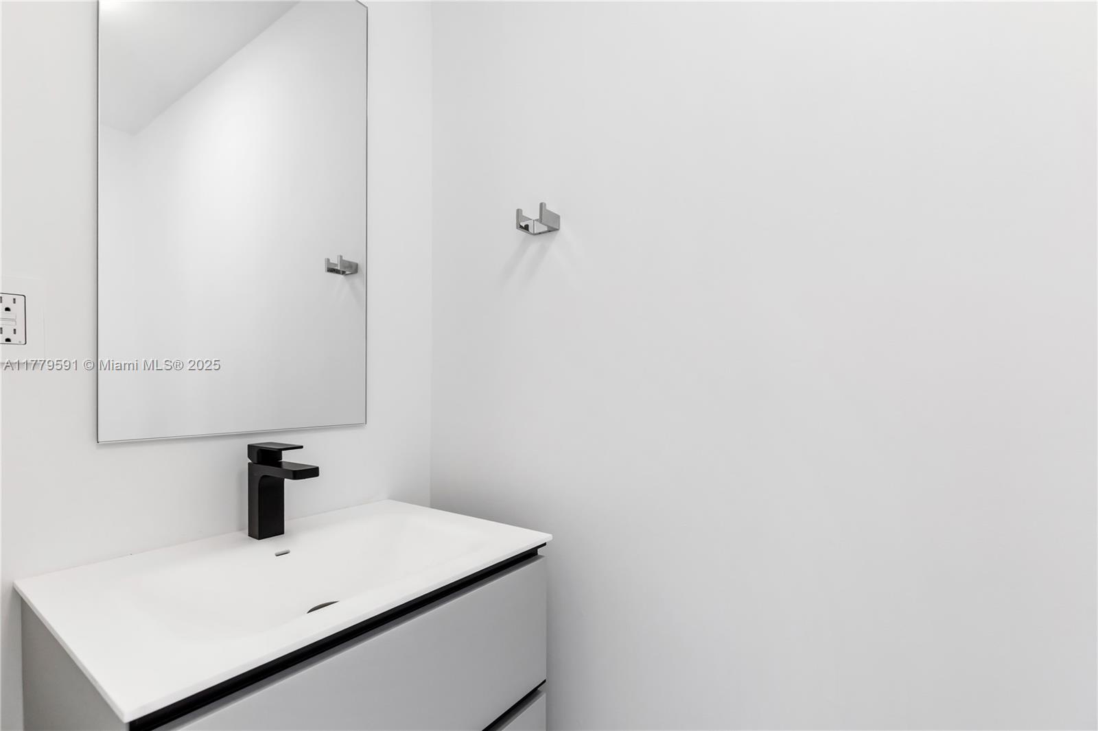 3045 Elizabeth Street, Unit 3045 Miami, FL 33133 - Photo 54 of 72 a bathroom with a sink