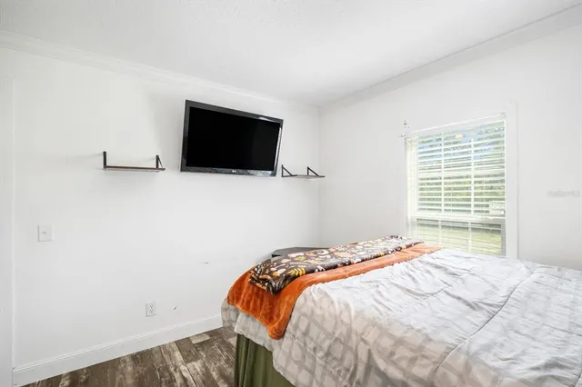a bathroom with a granite countertop sink toilet and a mirror