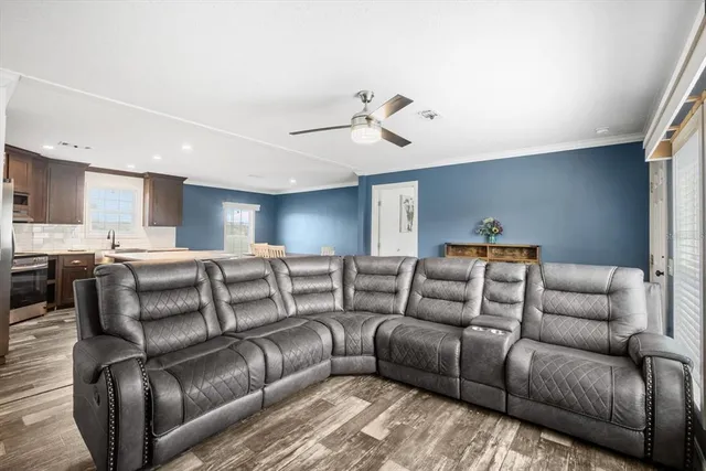 a kitchen with a stove a refrigerator and a sink