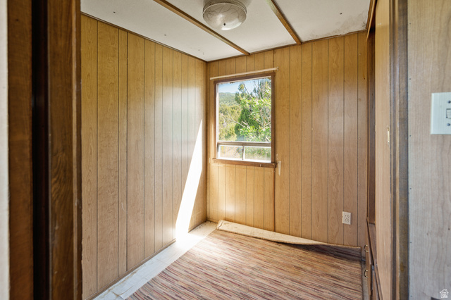 12615 Cedar Ridge Drive, Unit C41 Fairview, UT 84629 - Photo 13 of 32 Empty room with wood walls