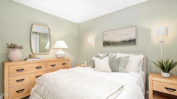 a bedroom with a bed and a dresser