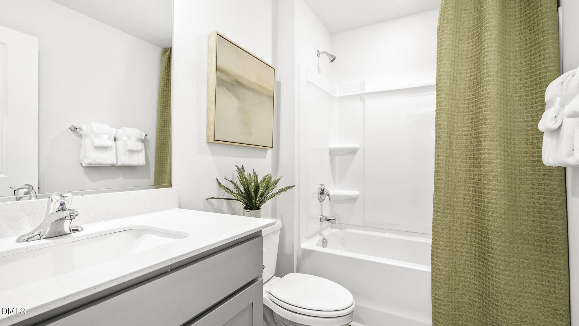 129 Daniel Road Wilson's Mills, NC 27577 - Photo 12 of 28 a bathroom with a granite countertop sink a toilet a mirror and shower