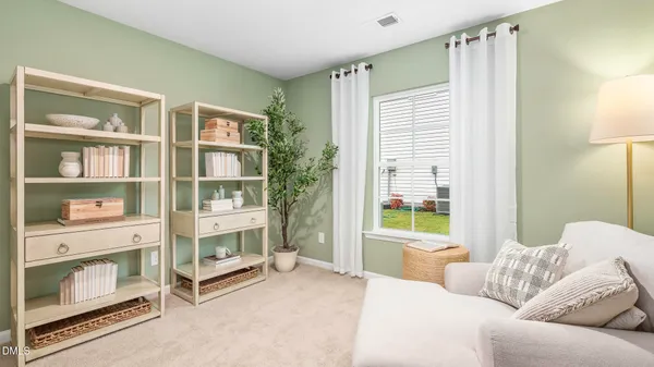 a bedroom with furniture and a window