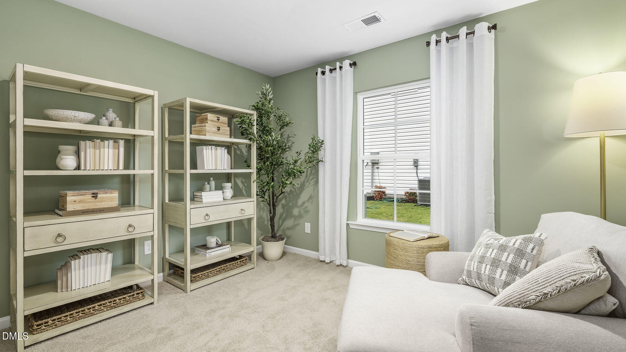 129 Daniel Road Wilson's Mills, NC 27577 - Photo 16 of 28 a bedroom with furniture and a window
