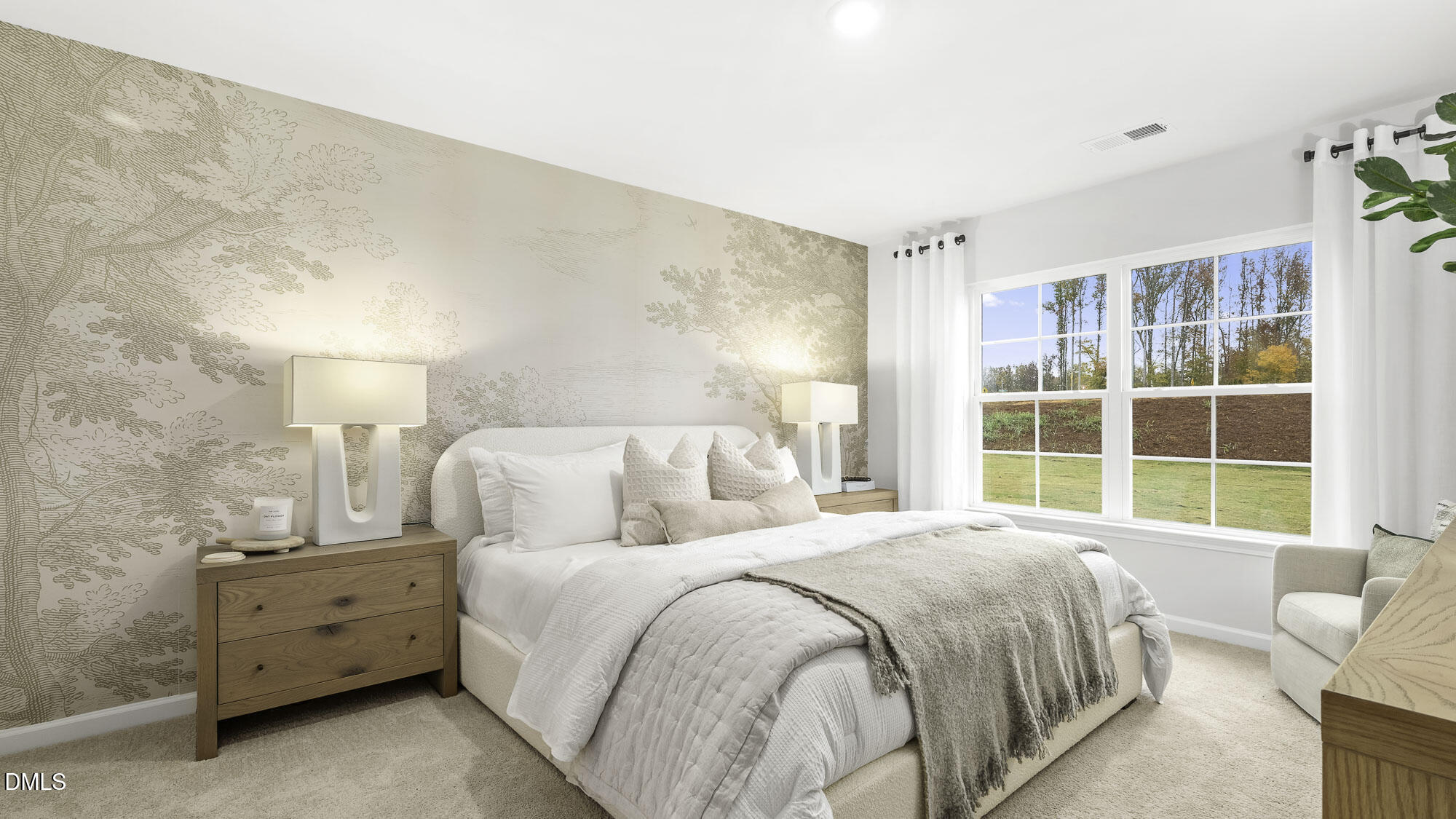 129 Daniel Road Wilson's Mills, NC 27577 - Photo 17 of 28 a spacious bedroom with a bed and a large window