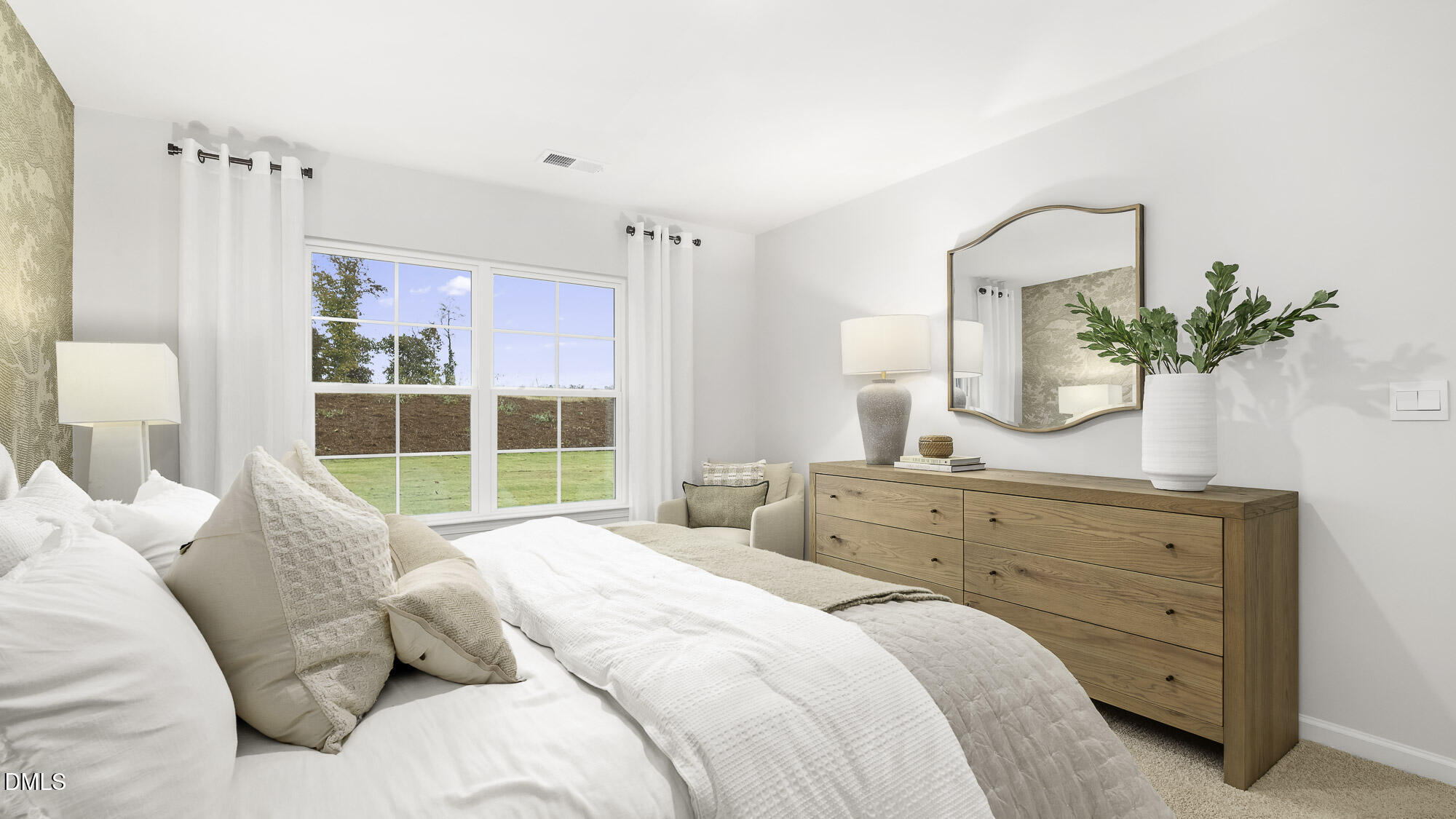 129 Daniel Road Wilson's Mills, NC 27577 - Photo 18 of 28 a bedroom with a large bed and a potted plant