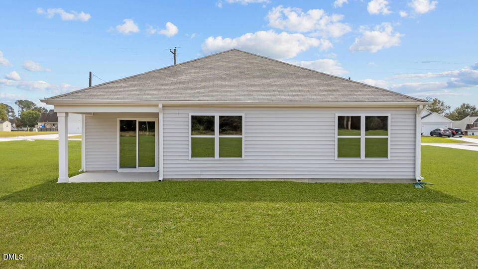 129 Daniel Road Wilson's Mills, NC 27577 - Photo 24 of 28 a front view of a house with a yard