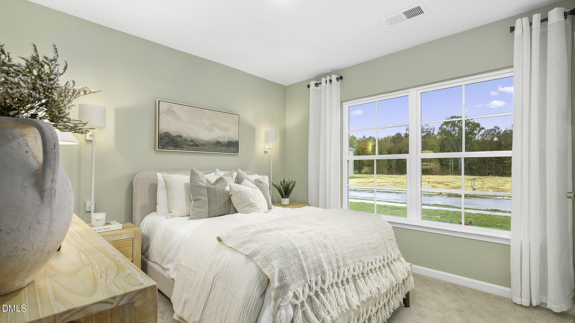 129 Daniel Road Wilson's Mills, NC 27577 - Photo 10 of 28 a bedroom with a large bed and a large window