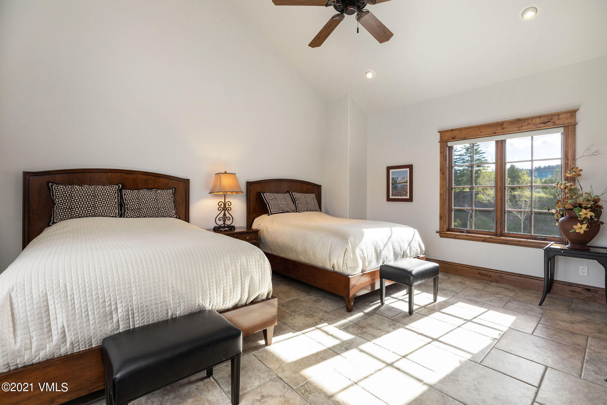 950 Cordillera Way Edwards, CO 81632 - Photo 15 of 26 a bed room with two beds and a chair