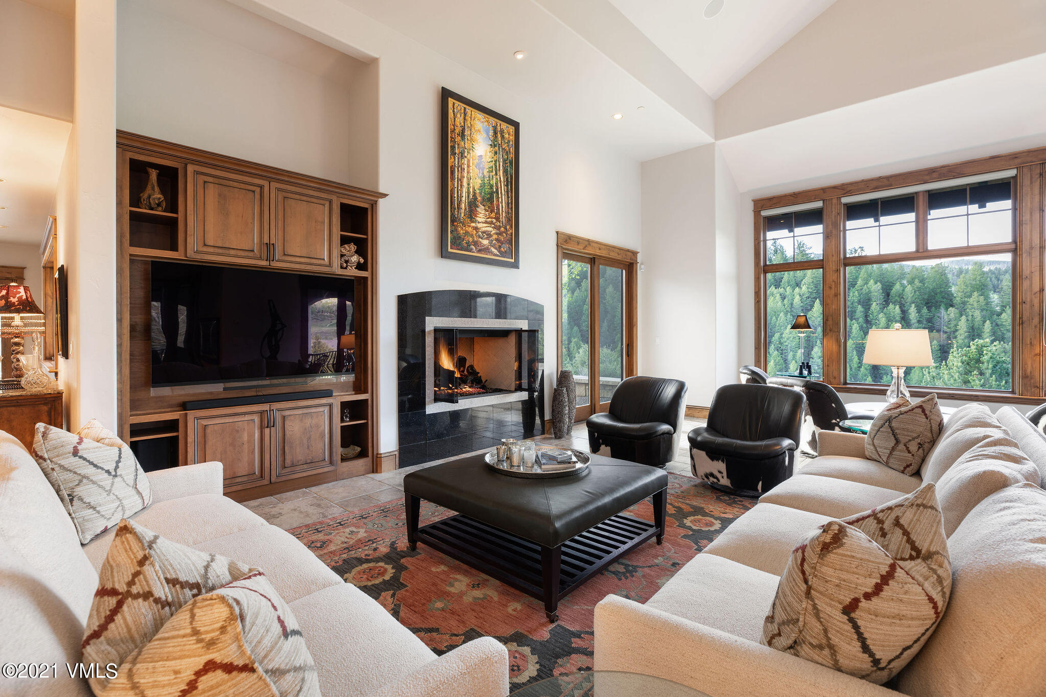 950 Cordillera Way Edwards, CO 81632 - Photo 2 of 26 a living room with furniture flat screen tv and a fireplace