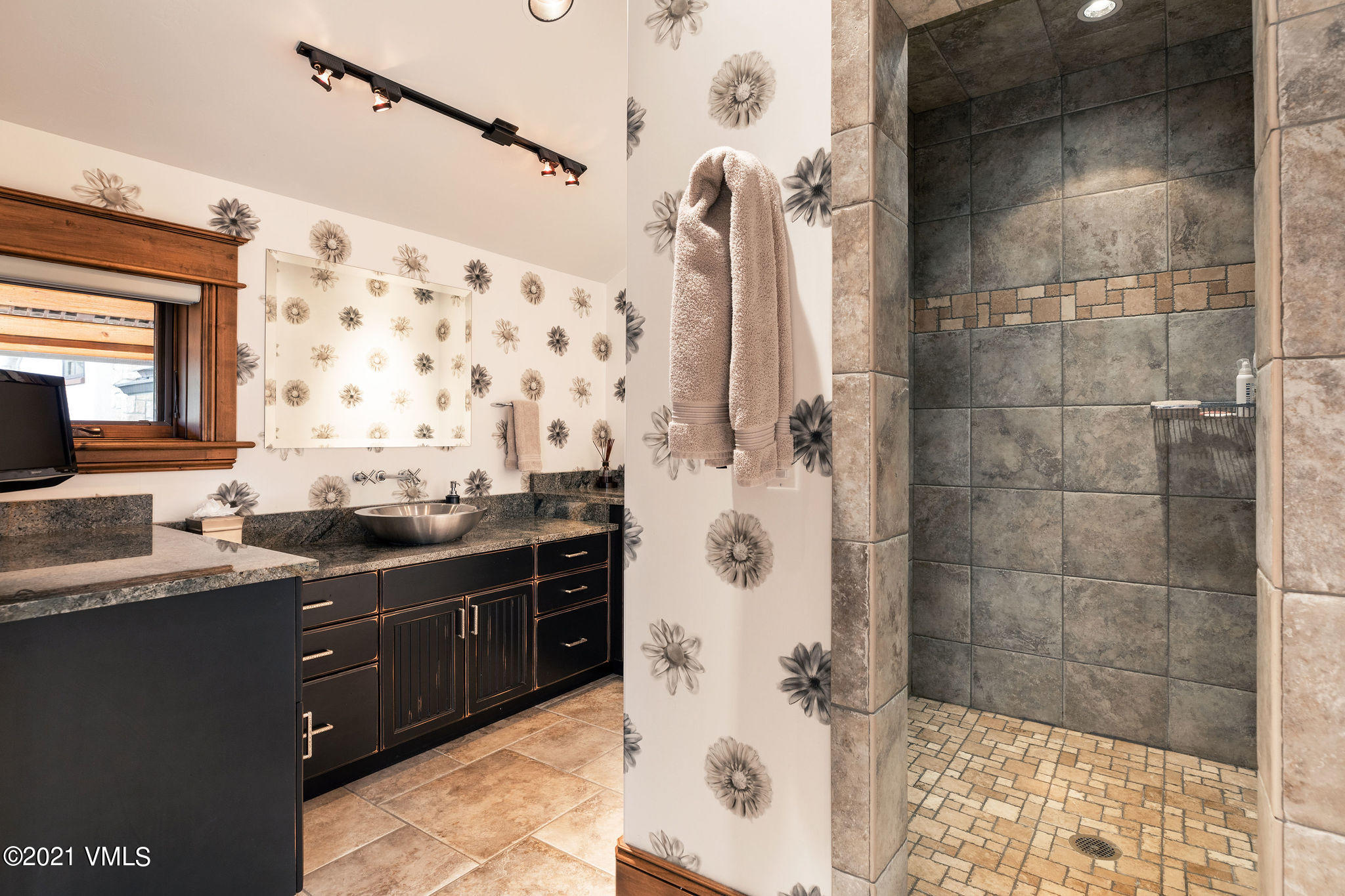 950 Cordillera Way Edwards, CO 81632 - Photo 10 of 26 a bathroom with a double vanity sink toilet and shower