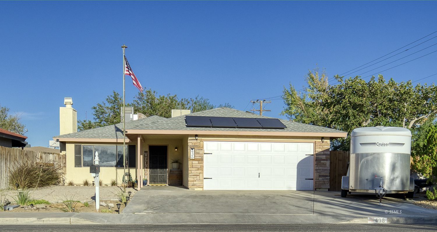 436 South Lincoln Street Ridgecrest, CA 93555 - Photo 1 of 34 a front view of a house with a yard