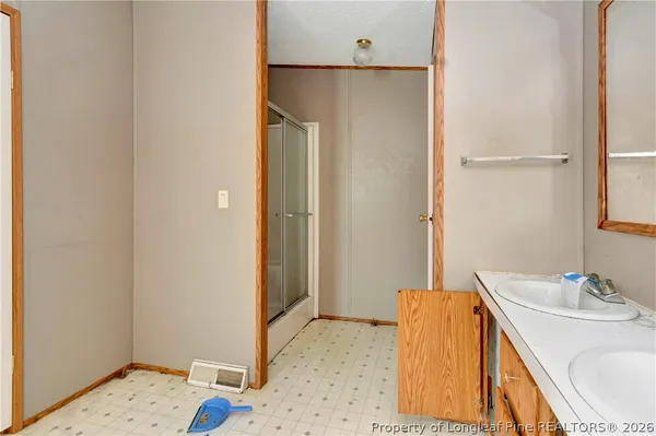 a view of room with window and ceiling fan