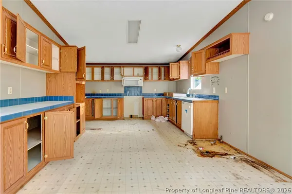 a view of a kitchen with furniture and a window