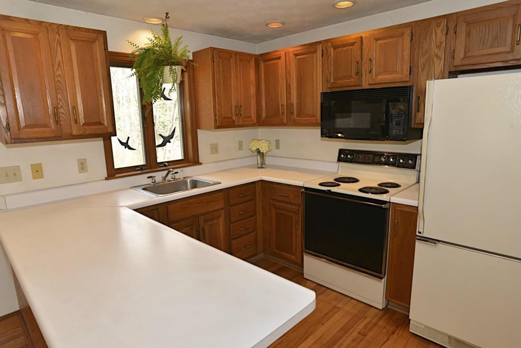 18 High Bluff Road Cape Elizabeth, ME 04107 - Photo 4 of 16 The kitchen is open to the living...