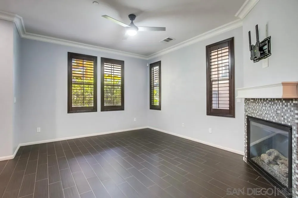1859 Khaki Lane Chula Vista, CA 91913 - Photo 11 of 62 a view of an empty room with wooden floor and a window