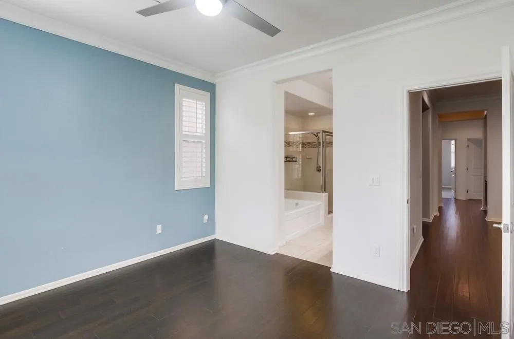 1859 Khaki Lane Chula Vista, CA 91913 - Photo 18 of 62 an empty room with wooden floor and windows