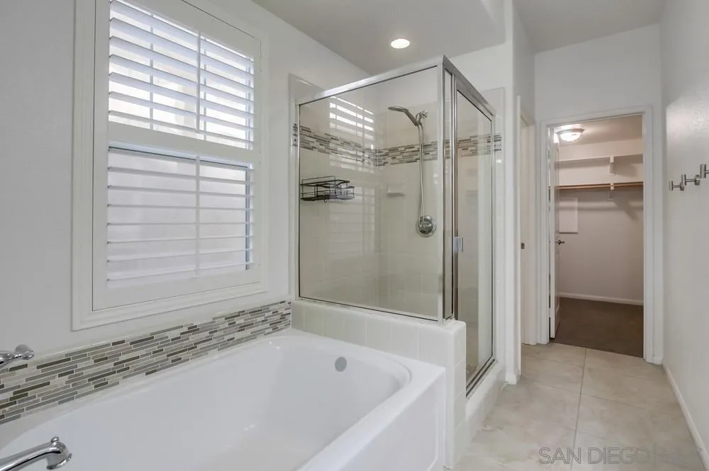 1859 Khaki Lane Chula Vista, CA 91913 - Photo 20 of 62 a bathroom with a bathtub and a shower