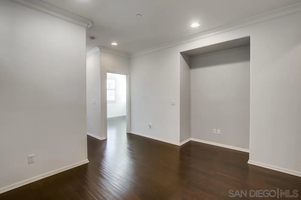 1859 Khaki Lane Chula Vista, CA 91913 - Photo 27 of 62 a view of an empty room with wooden floor and a window